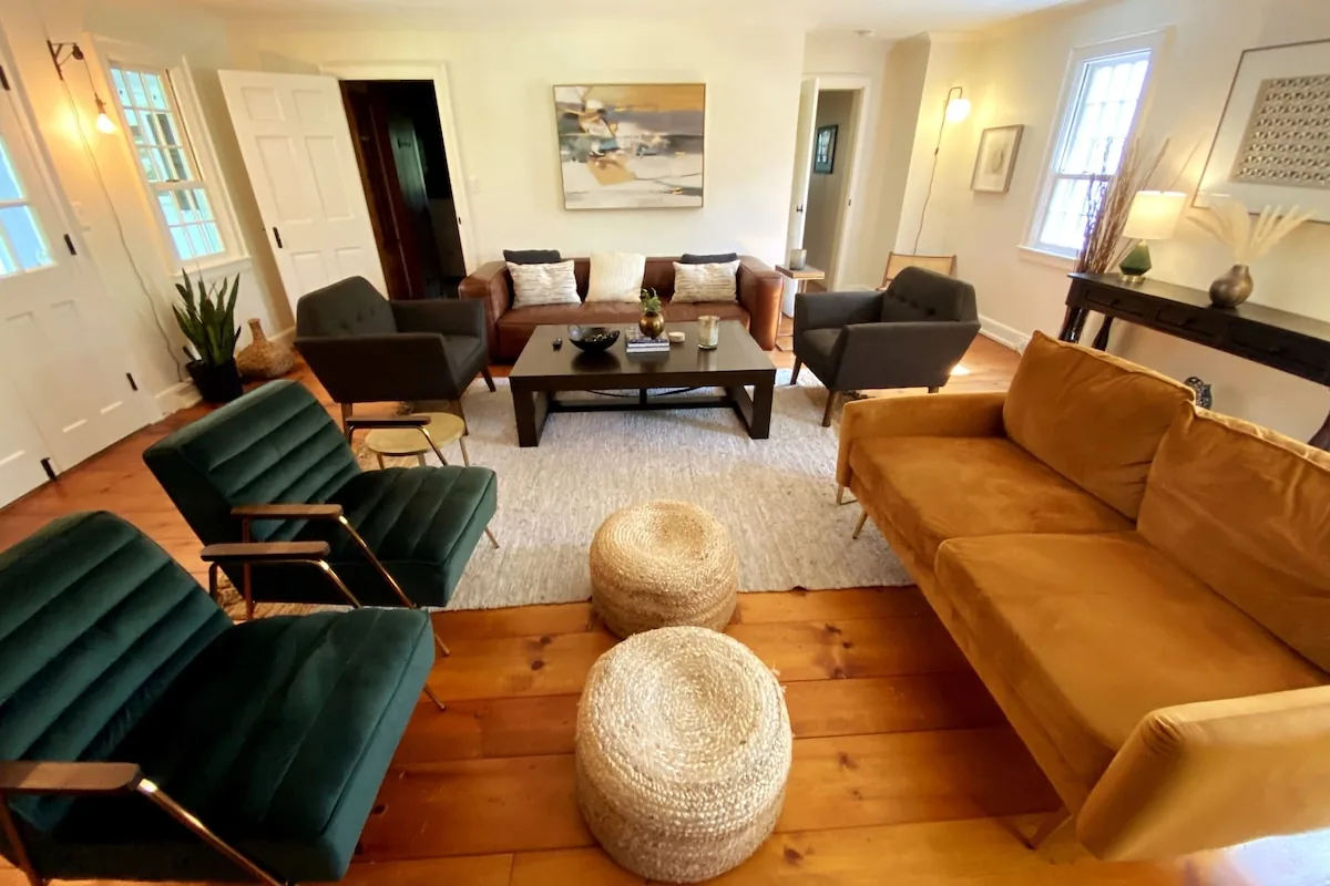 Living room with generous seating and warm wood floors