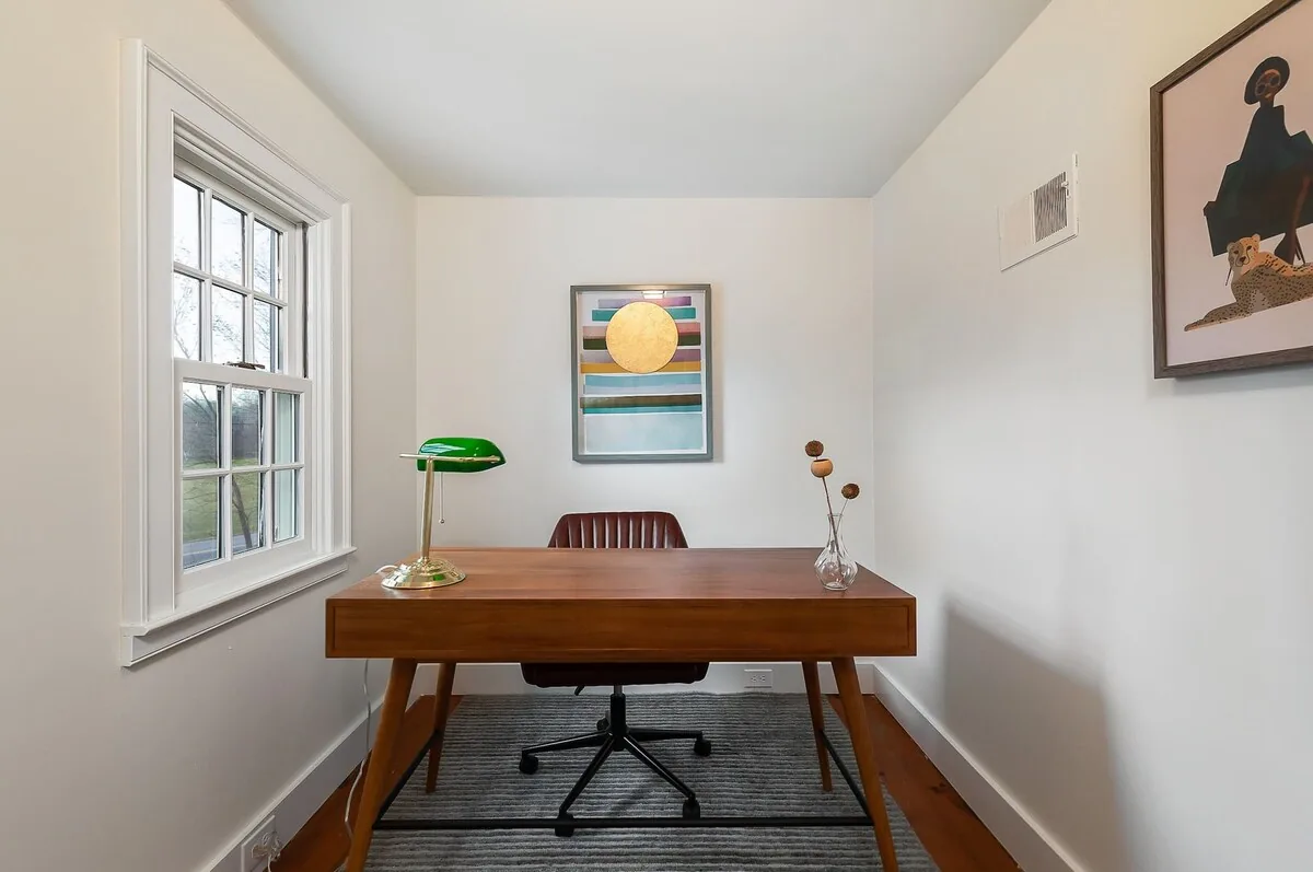 Quiet office with desk beside a window