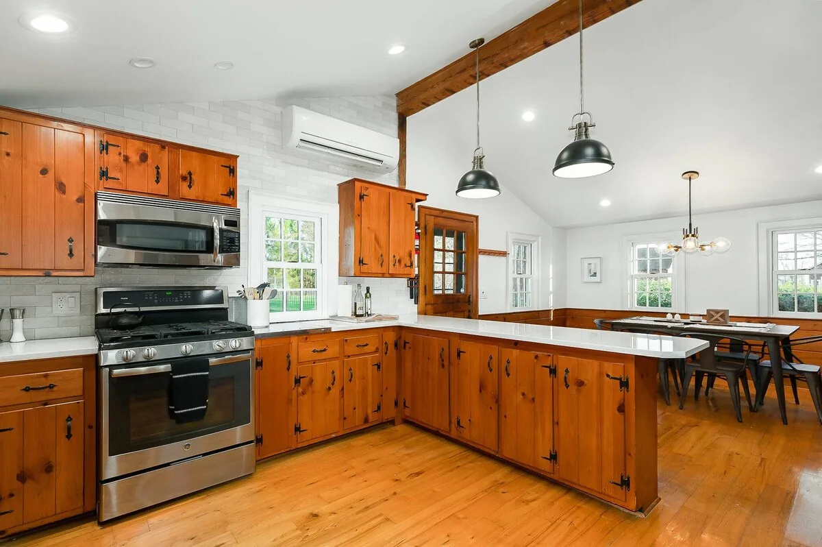 Farmhouse kitchen with broad prep counters and dining area