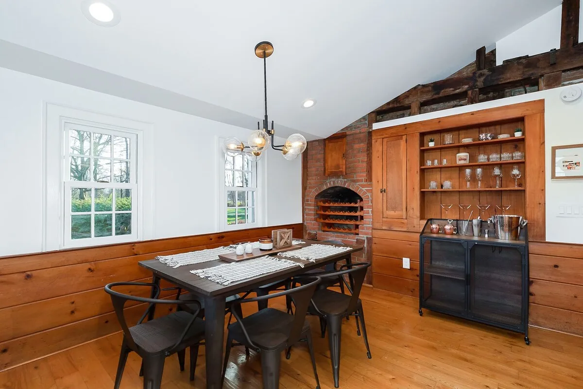 Eat-in kitchen with wood table and built-in cabinetry