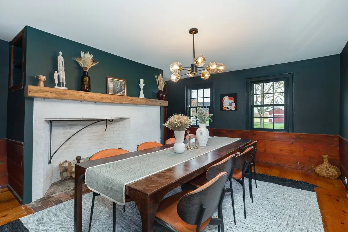 Dining table beside the original fireplace