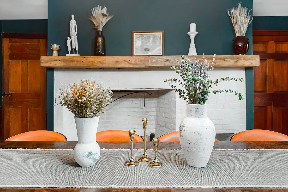 Original fireplace mantel dressed with flowers