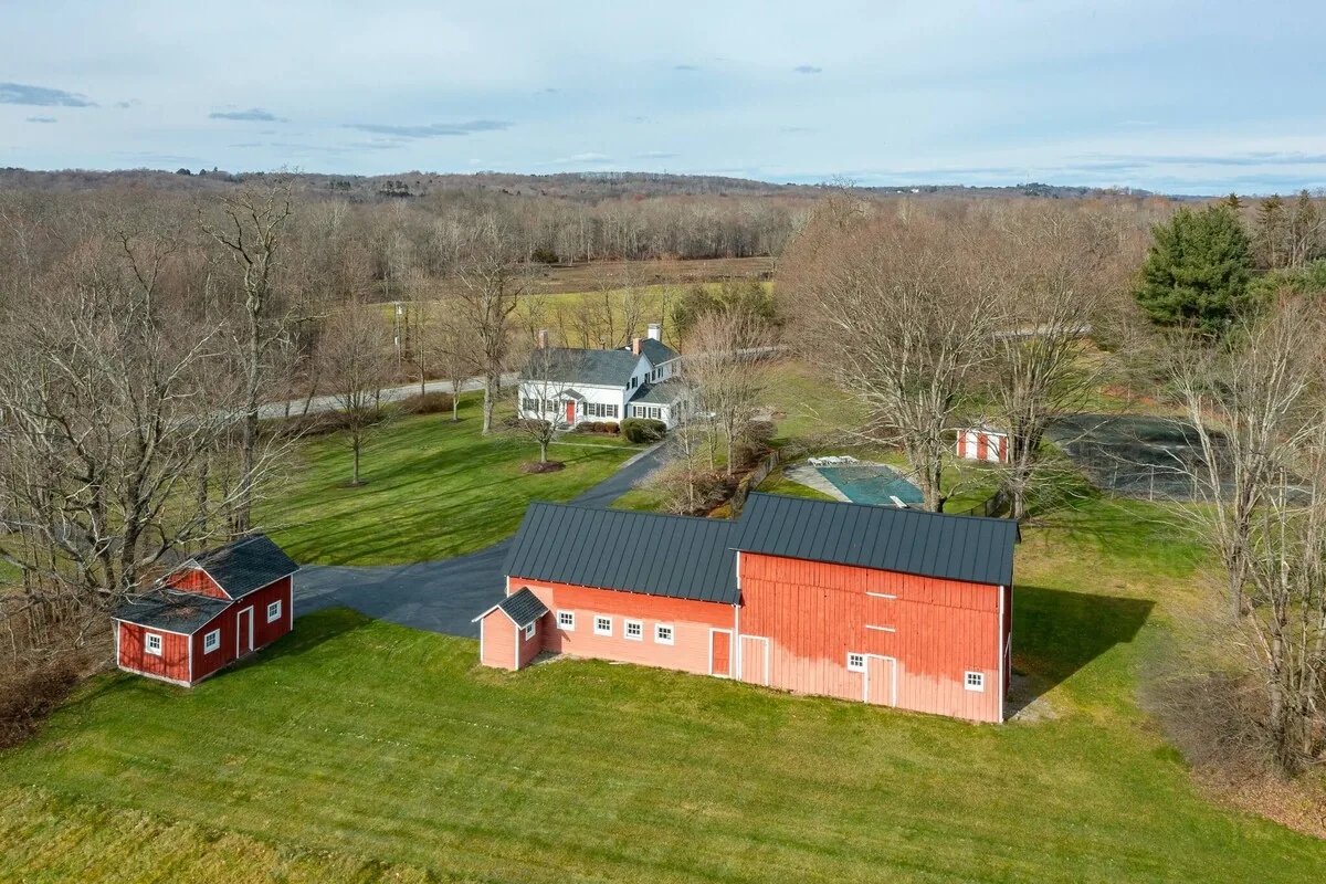 Aerial view of the red barns and surrounding fields